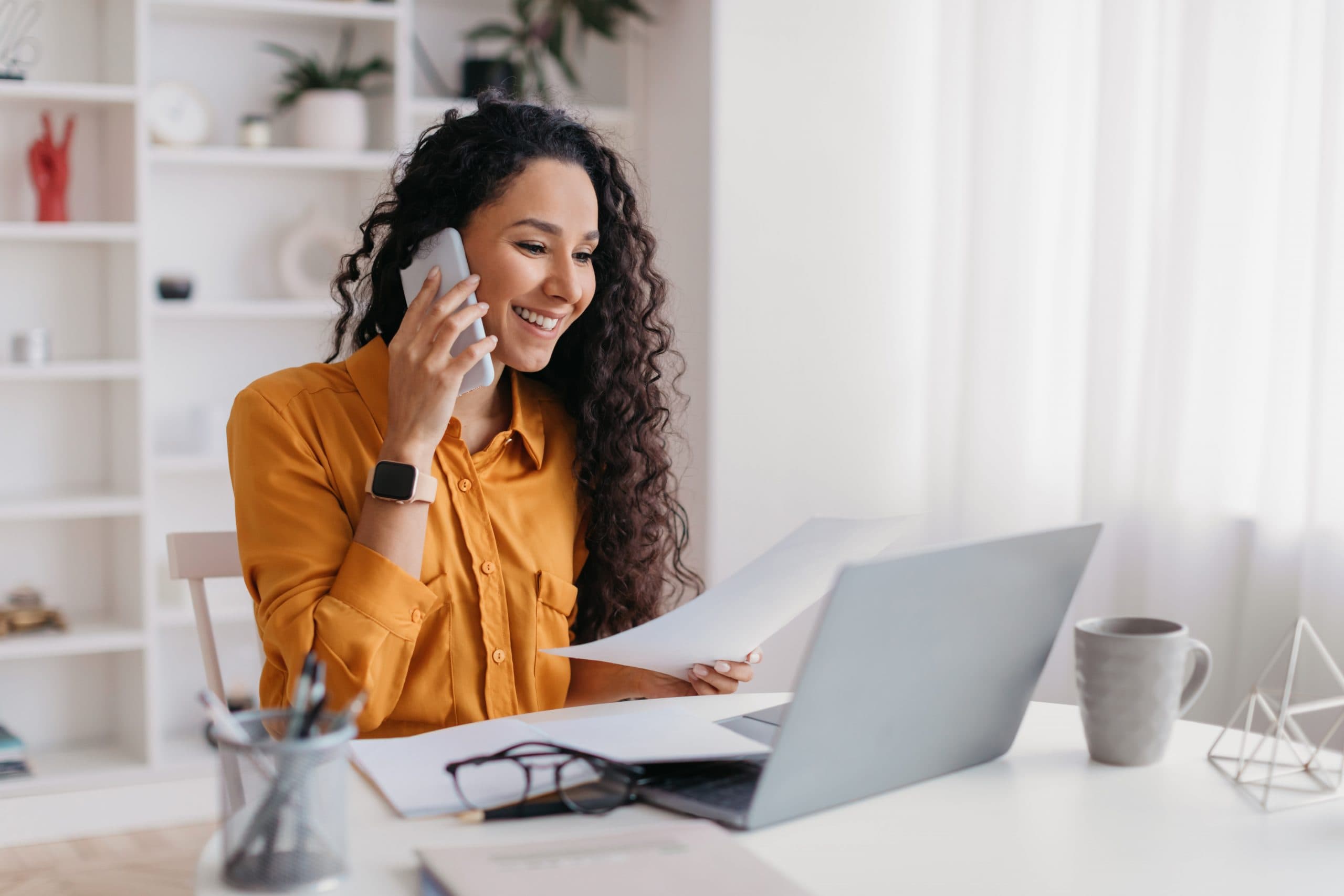 Business owner smiling while talking on the phone